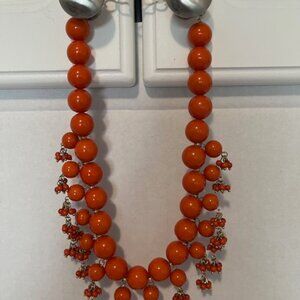Orange beads statement necklace.